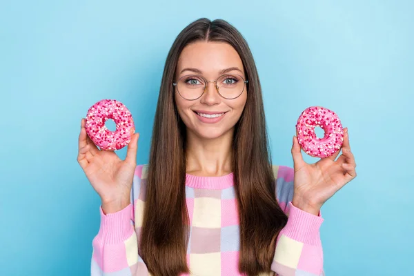 Photo of nice cooker lady demonstrate fresh baked donut wear specs pullover isolated blue color background — Stock Photo, Image