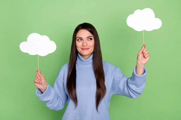 Photo of cute young brunette lady look clouds wear blue turtleneck isolated on green color background — Stock Photo, Image