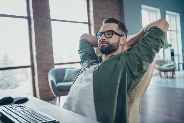 Photo of smiling guy expert end debugging website secure optimization hands head sit desktop in modern loft workspace — Stock Photo, Image