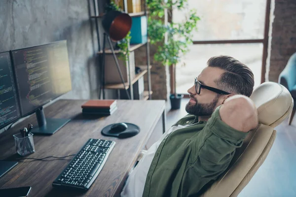 Profile side view portrait of attractive skilled dreamy brunet guy developing web site project start-up at work workplace workstation indoors — Stock Photo, Image