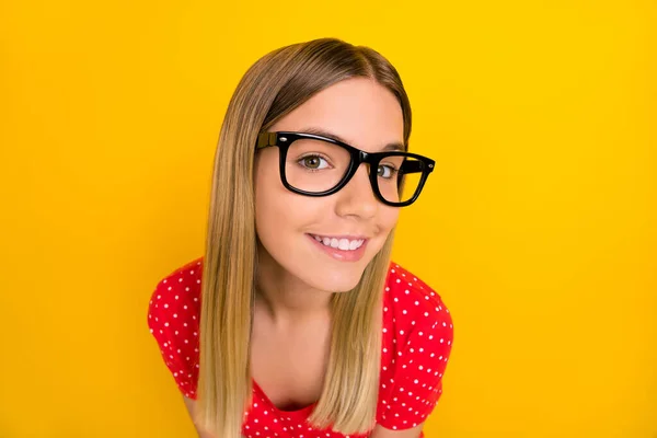 Photo of young lovely lady wonder guess eyewear hmm thoughtful isolated over yellow color background