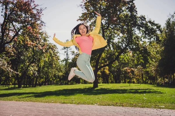 Full length body size view of attractive ecstatic cheerful girl jumping having fun healthy spirit morning outdoors — Stock Photo, Image