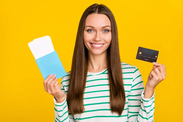 Photo of young lady purchase ticket fly abroad tourist vacation credit card salary isolated over yellow color background — Stock Photo, Image