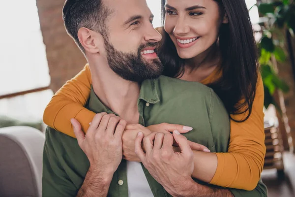 Cropped portrait of attractive sweet cute careful cheerful couple spouses cuddling spending vacation at home house flat indoors — Stock Photo, Image
