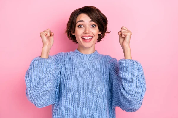 Photo of delighted cheerful lady raise fists champion goal accomplishment isolated on pink color background — Stock Photo, Image