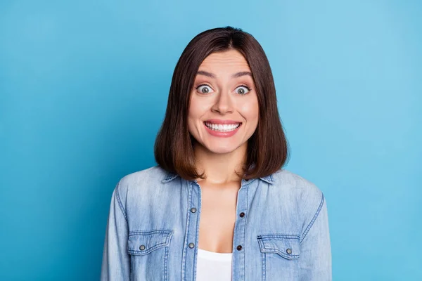 Photo of adorable sweet lady dressed denim shirt showing white teeth smiling isolated blue color background — Stock Photo, Image