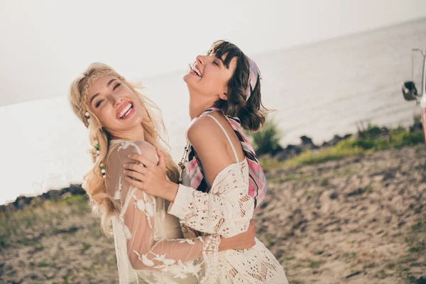 Photo of two funny crazy ladies enjoy embrace laugh wear casual outfit nature seaside beach outdoors — Stock Photo, Image