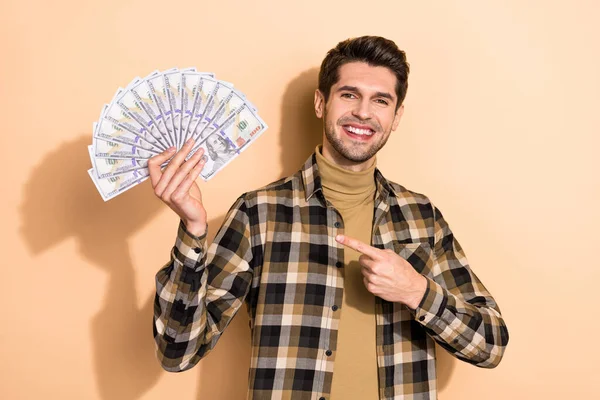 Photo of positive banker economist guy demonstrate lottery jackpot earnings money isolated pastel color background — Stock Photo, Image