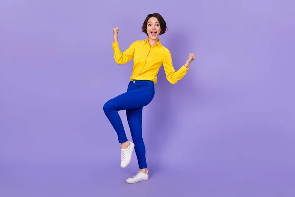 Full size photo of hooray millennial brunette lady yell wear shirt trousers sneakers isolated on purple color background — Stock Photo, Image