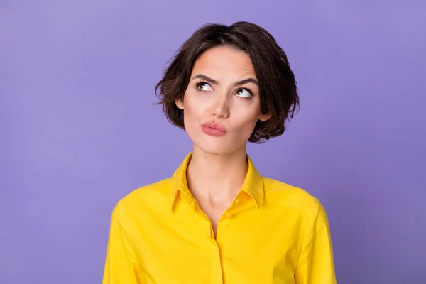 Фото hr young bob hairdo lady look up wear yellow blouse isolated on violet color background — стоковое фото