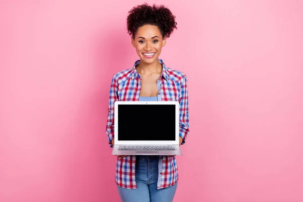 Portrait of attractive cheerful wavy-haired girl holding in hands copy space laptop isolated over pink pastel color background — Stock Photo, Image