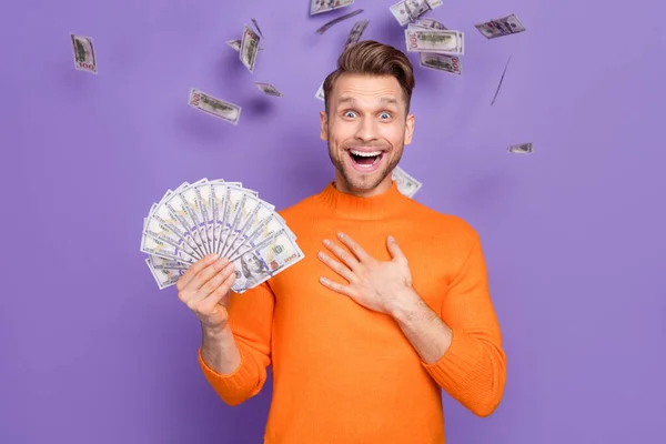 Photo of cheerful overjoyed man cant believe he won money lottery prize isolated on violet color background — Stock Photo, Image