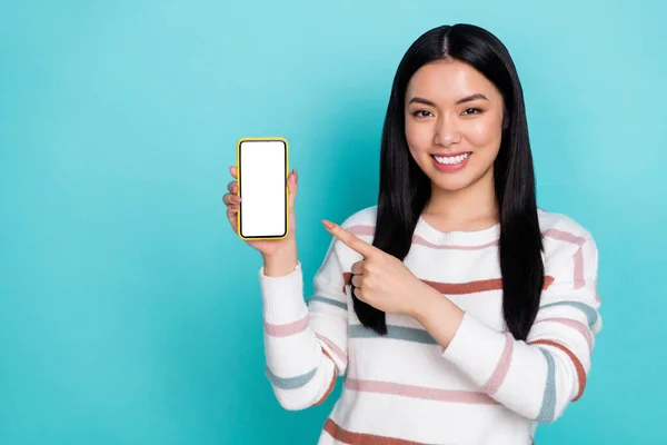 Photo of young charming woman suggest recommend you new cellphone model isolated on turquoise color background — 스톡 사진