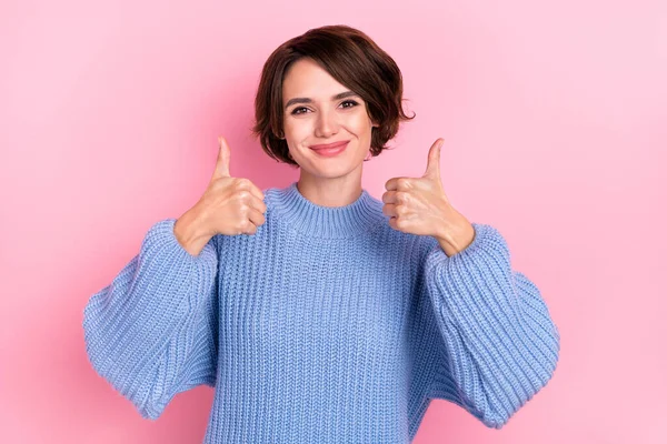 Photo of positive cute girl two hands demonstrate thumb up look camera isolated on pink color background — Stock Photo, Image