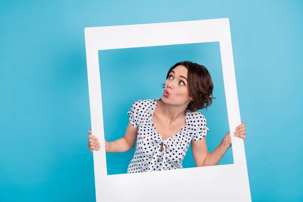 Portrait of impressed girl plump lips look interested empty space isolated on blue color background — 스톡 사진