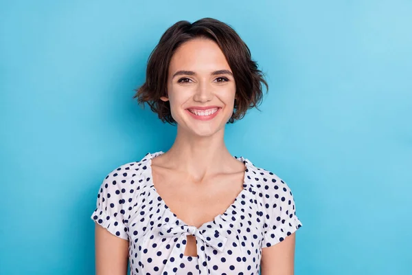 Photo of sweet young bob hairdo lady wear dotted blouse isolated on blue color background — ストック写真
