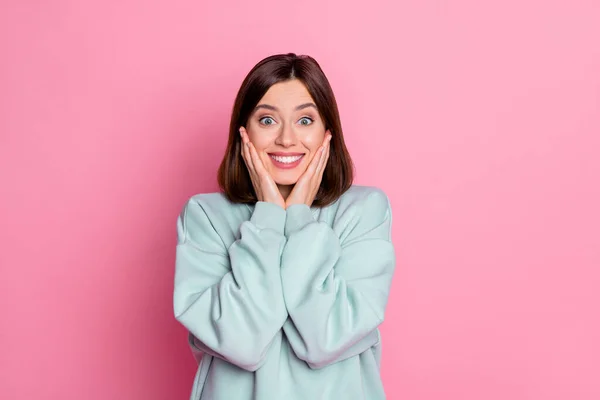 Photo of hooray millennial lady hands face wear blue hoodie isolated on pink color background — Stock Photo, Image