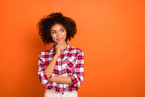 Photo of millennial curly lady hand face look promo wear plaid shirt isolated on orange color background — 스톡 사진