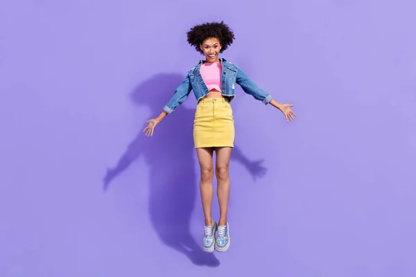Full length body size view of attractive cheerful skinny slim girl jumping rest isolated on bright violet purple color background — стоковое фото