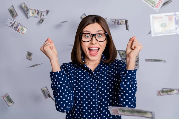 Photo of funny lucky lady celebrate lucky bet win money wealth wear dotted blouse isolated grey color background — ストック写真