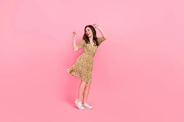 Full size portrait of overjoyed satisfied lady raise arms spend pastime isolated on pink color background — Photo