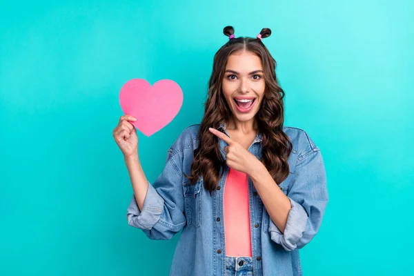 Photo of young pretty girl indicate finger heart shape promo recommend sale present isolated over teal color background — 스톡 사진