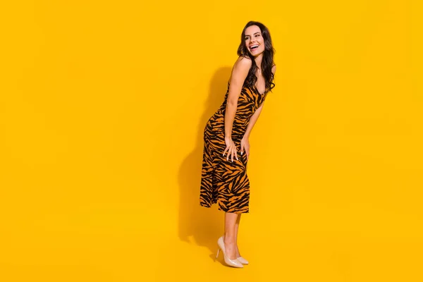 Full size profile side photo of young cheerful lady look empty space curious isolated over yellow color background — Foto de Stock