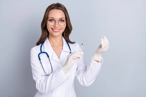 Photo of young lady physician hold syringe campaign vaccination protection isolated over grey color background — Stockfoto