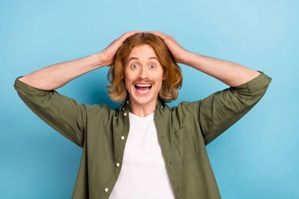 Portrait of attractive cheerful stunned guy wow incredible news isolated over pastel blue color background — Stockfoto