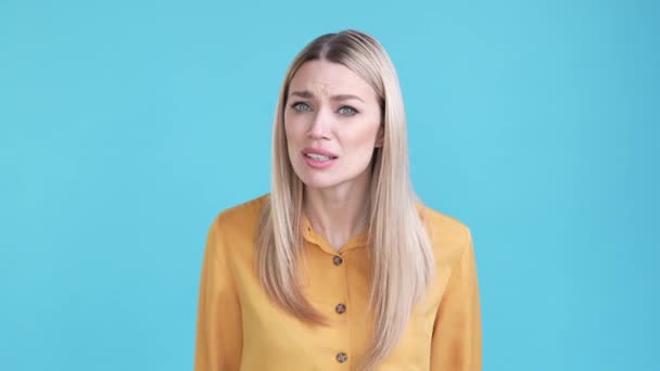 Lady not hear difficulty secret disappointed isolated blue color background — Wideo stockowe