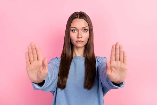 Portrait of attractive content girl showing palms stop violation human rights decision isolated over pink pastel color background — стоковое фото