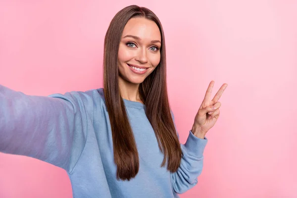 Self-portrait of attractive girly cheerful girl showing v-sign rest isolated over pink pastel color background — Fotografia de Stock