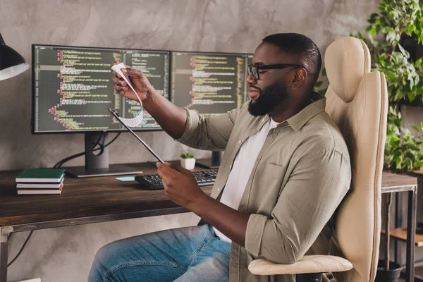 Profile photo of happy intelligent person sitting chair read clipboard report workstation office indoors