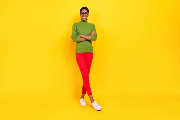 Photo of cheerful pretty trans woman wear green turtleneck arms crossed isolated yellow color background — Zdjęcie stockowe