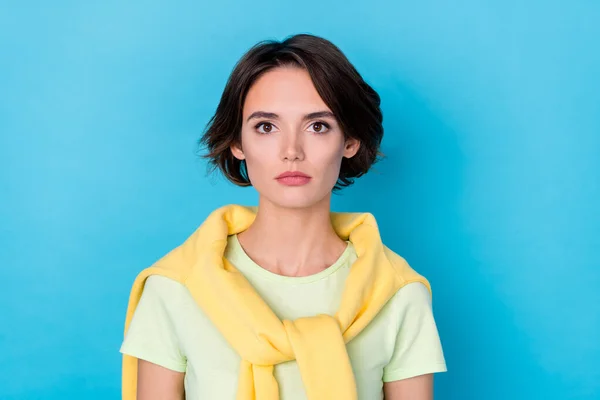 Photo of calm millennial brunette lady wear yellow t-shirt isolated on blue color background — 스톡 사진