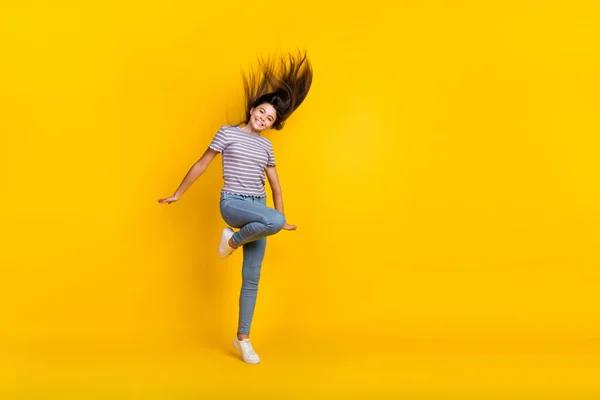 Full size photo of youth cheerful lady have fun jump up active isolated over yellow color background — Fotografia de Stock