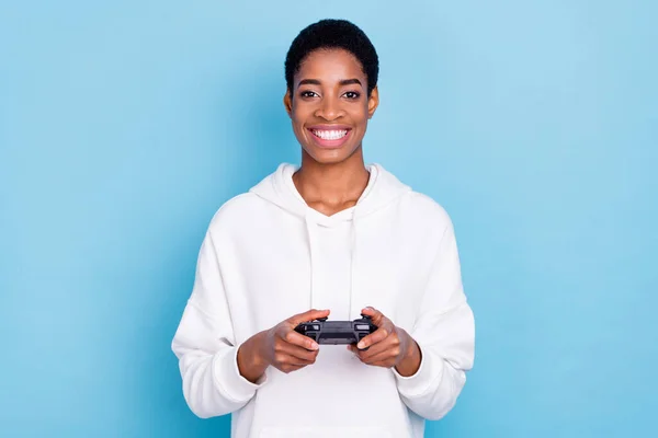 Photo of pretty beautiful trans girl wear white sweatshirt holding playstation isolated blue color background —  Fotos de Stock