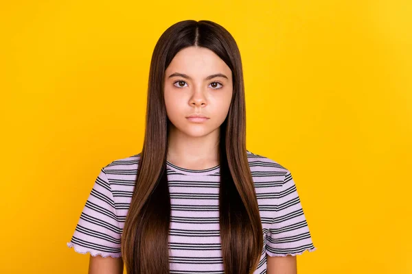 Photo of young attractive girl long hair serious smart wear striped t-shirt isolated over yellow color background — Stock Photo, Image