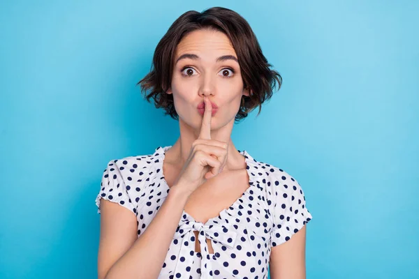 Photo of young person finger demonstrate shush symbol look camera isolated on blue color background —  Fotos de Stock