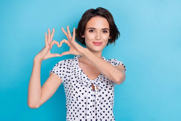 Portrait of gorgeous positive lady hands make heart figure isolated on blue color background —  Fotos de Stock