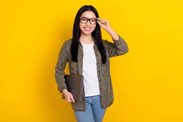 Photo of cheerful good mood lady wear spectacles working in modern it company isolated on yellow color background — стоковое фото