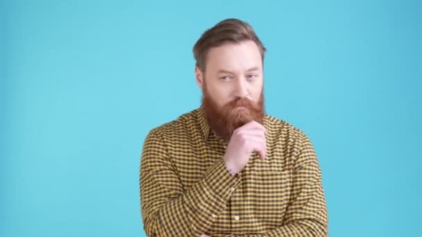 Interested guy feel uncertain think thought isolated blue color background — Wideo stockowe