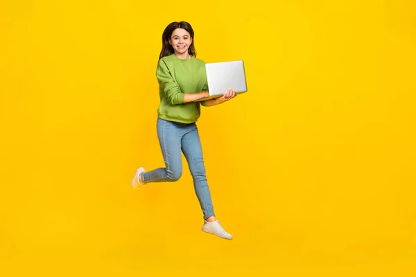 Full length photo of young girl jump shooting selfie mobile show peace v-symbol isolated over yellow color background — Zdjęcie stockowe