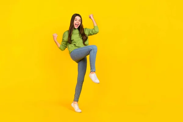 Full size photo of young pretty excited girl rejoice luck discount fists hands triumph isolated over yellow color background — Fotografia de Stock