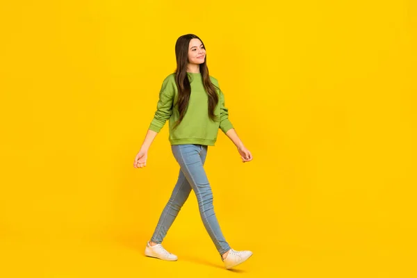 Full body profile side photo of young pretty girl go look empty space denim isolated over yellow color background — Fotografia de Stock