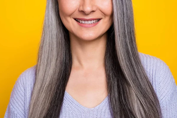 Cropped photo of charming mature lady showing her white teeth after dentist visit isolated on yellow color background — ストック写真