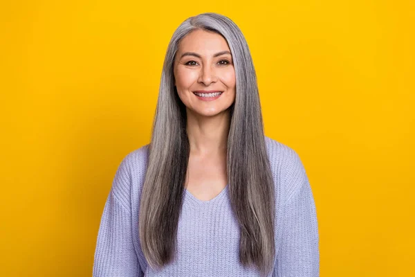 Photo of mature cheerful pretty skilled business lady in comfy knitted sweater isolated on yellow color background — Stok fotoğraf