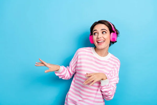 Photo of cute good mood lady look empty space fooling around have fun dancing isolated on blue color background — Stock fotografie