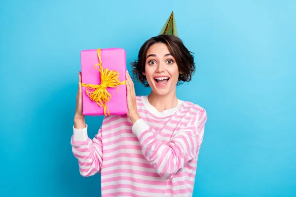 Photo of charming ecstatic overjoyed lady receive unexpected birthday gift present isolated on blue color background — Zdjęcie stockowe