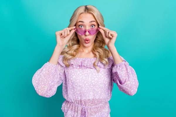 Photo of shiny impressed lady wear violet blouse arms pink glasses big eyes isolated turquoise color background — Stock Photo, Image